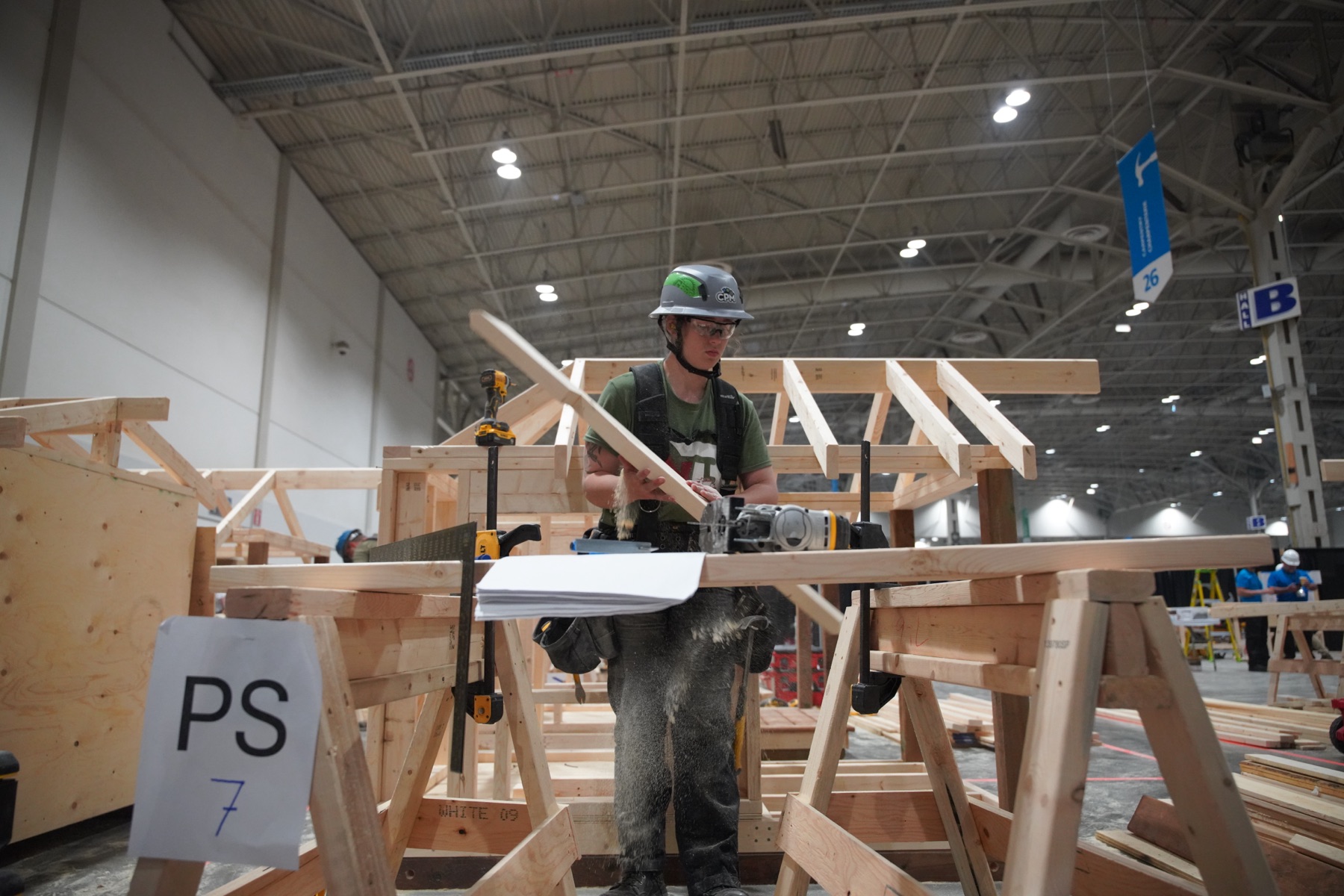 Competitor assembling a roof truss at a skilled trades competition