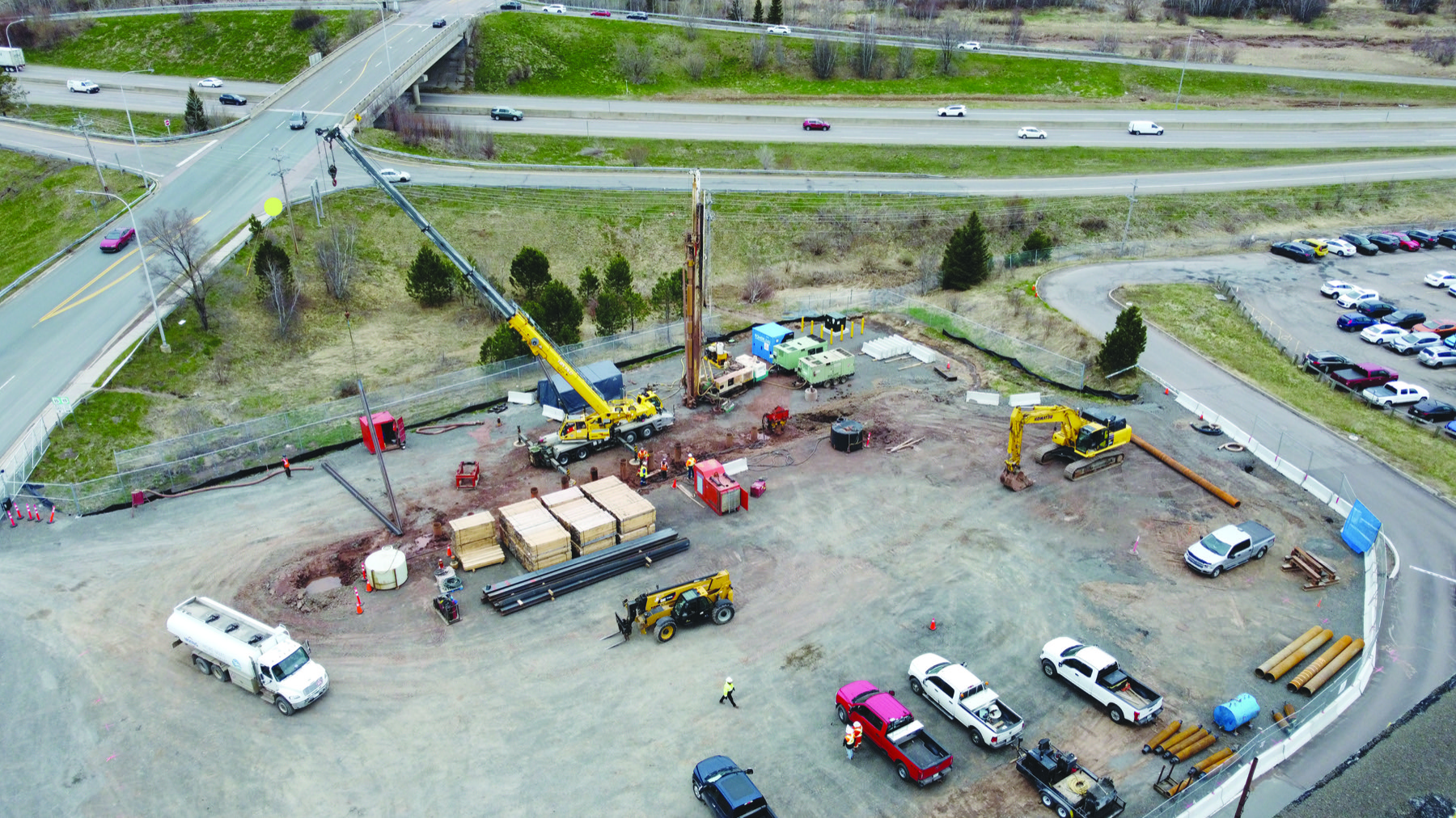 Aerial view of an active construction site with cranes in New Brunswick