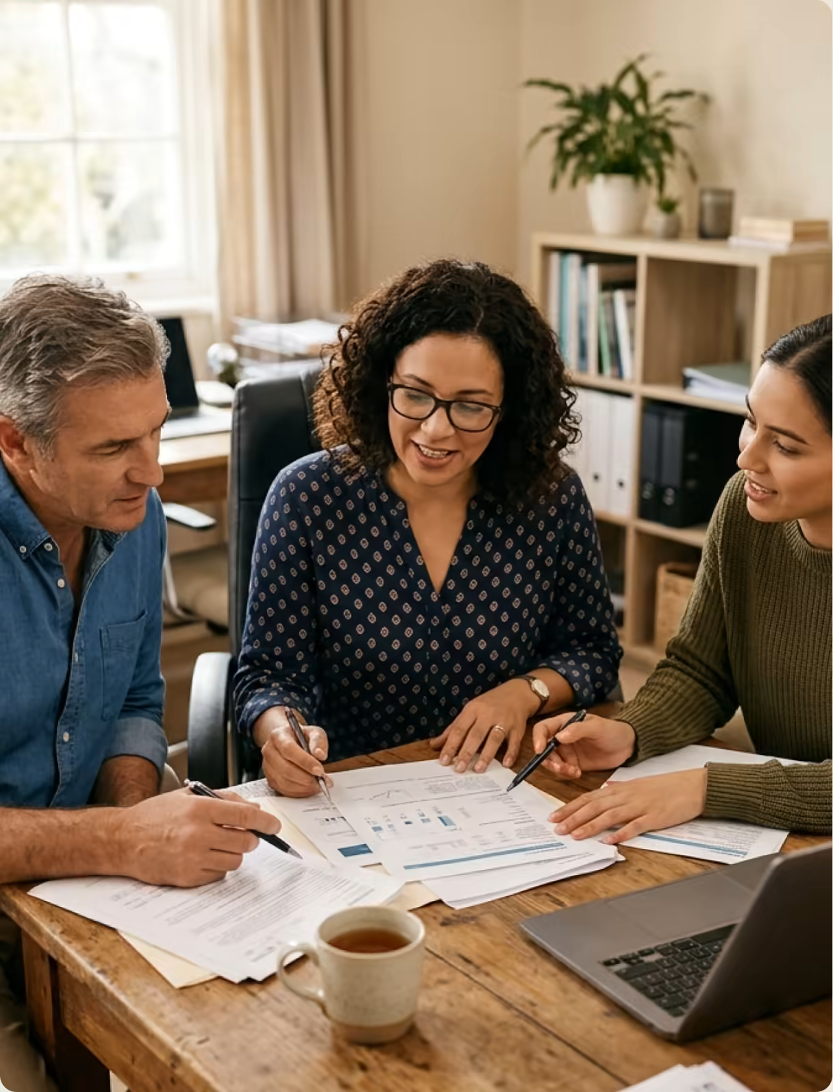 A care team reviewing patient follow-up plans together at a table