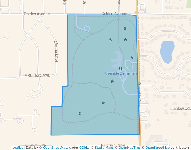 Map showing Riverside Elementary school area in Battle Creek, Michigan, bordered by Golden Avenue, Diversion Road, and local streets, with walking trails and playground icons.