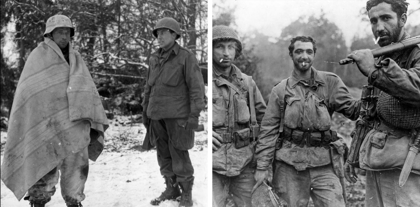 Black and white photo of World War II soldiers; on the left, a soldier wrapped in a blanket stands beside another soldier wearing a helmet, snowy forest background; on the right, three soldiers with cigarettes pose, one holding a rifle, outdoor setting.