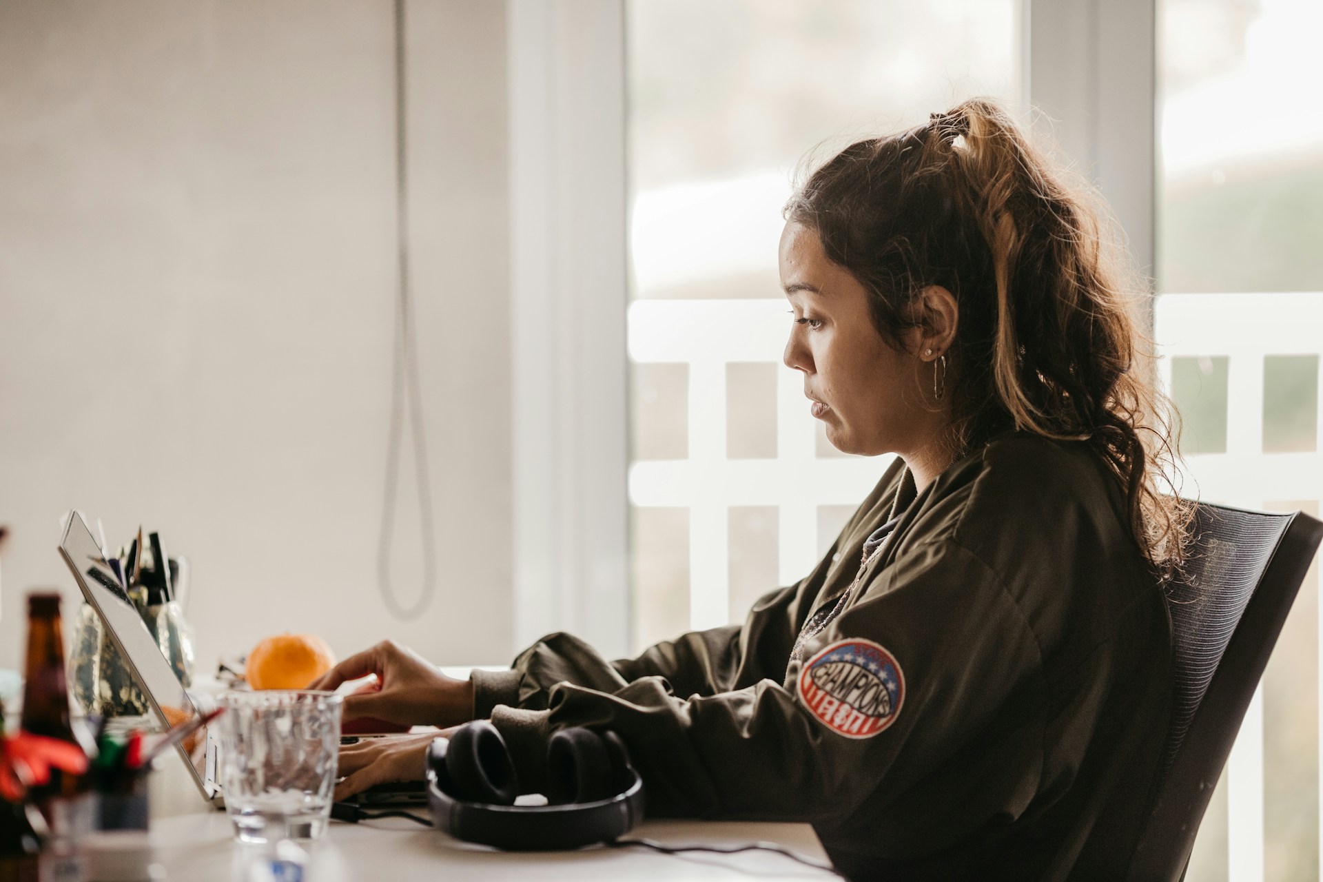 Distressed martial arts coach in front of laptop