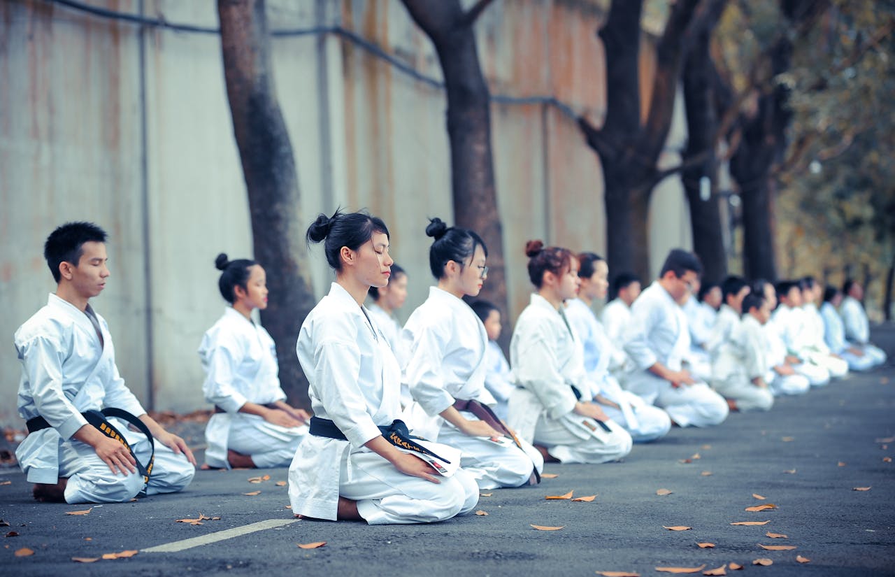 Martial arts practitioners lined up before an exam