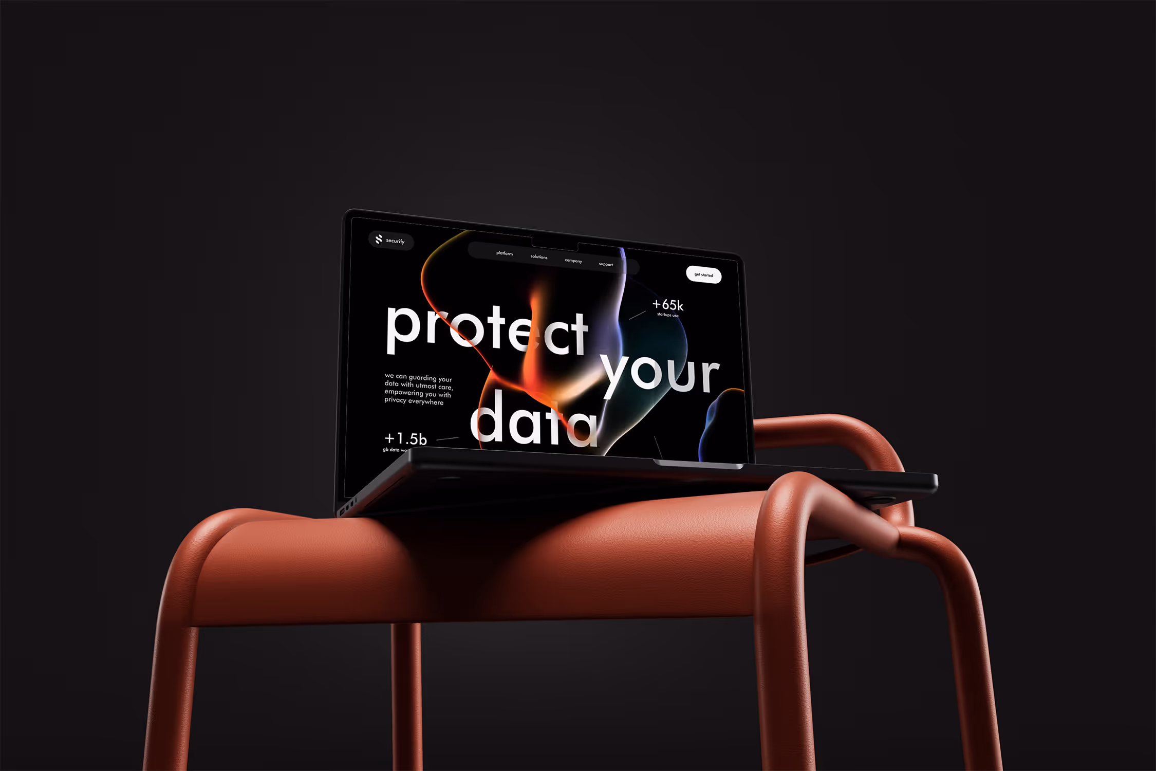 Laptop cu ecran rosu afisand mesaj motivational pe fundal stancos