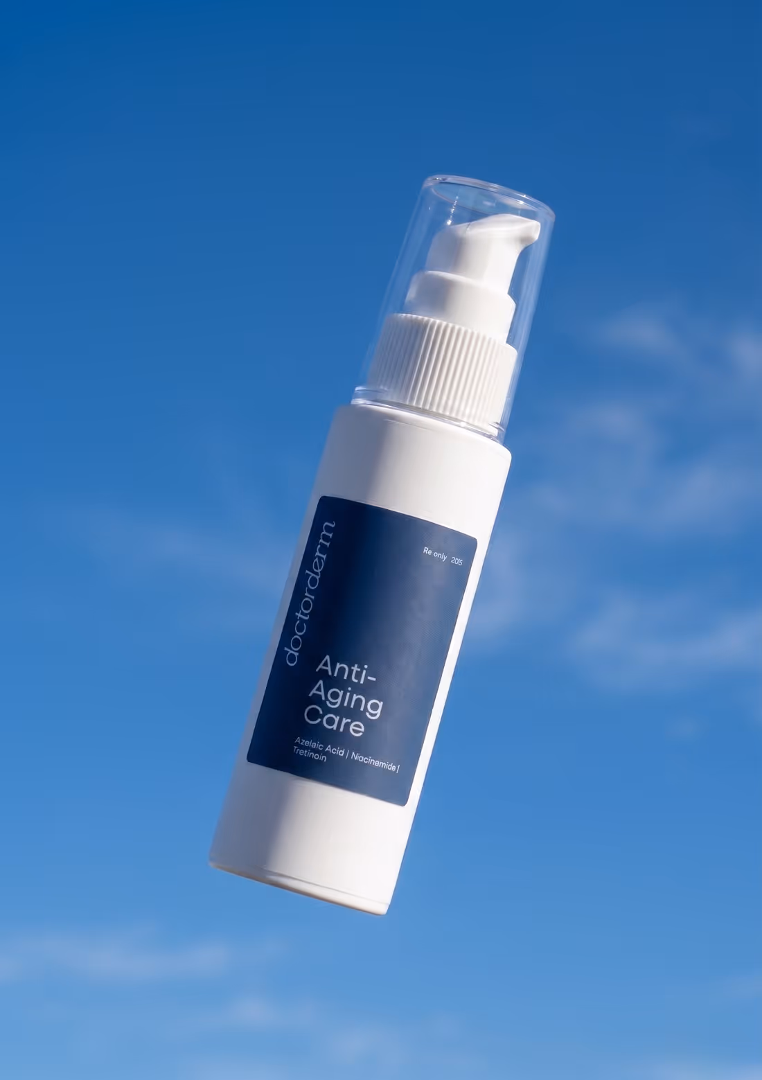 DoctorDerm Anti-Aging Care bottle against a blue sky