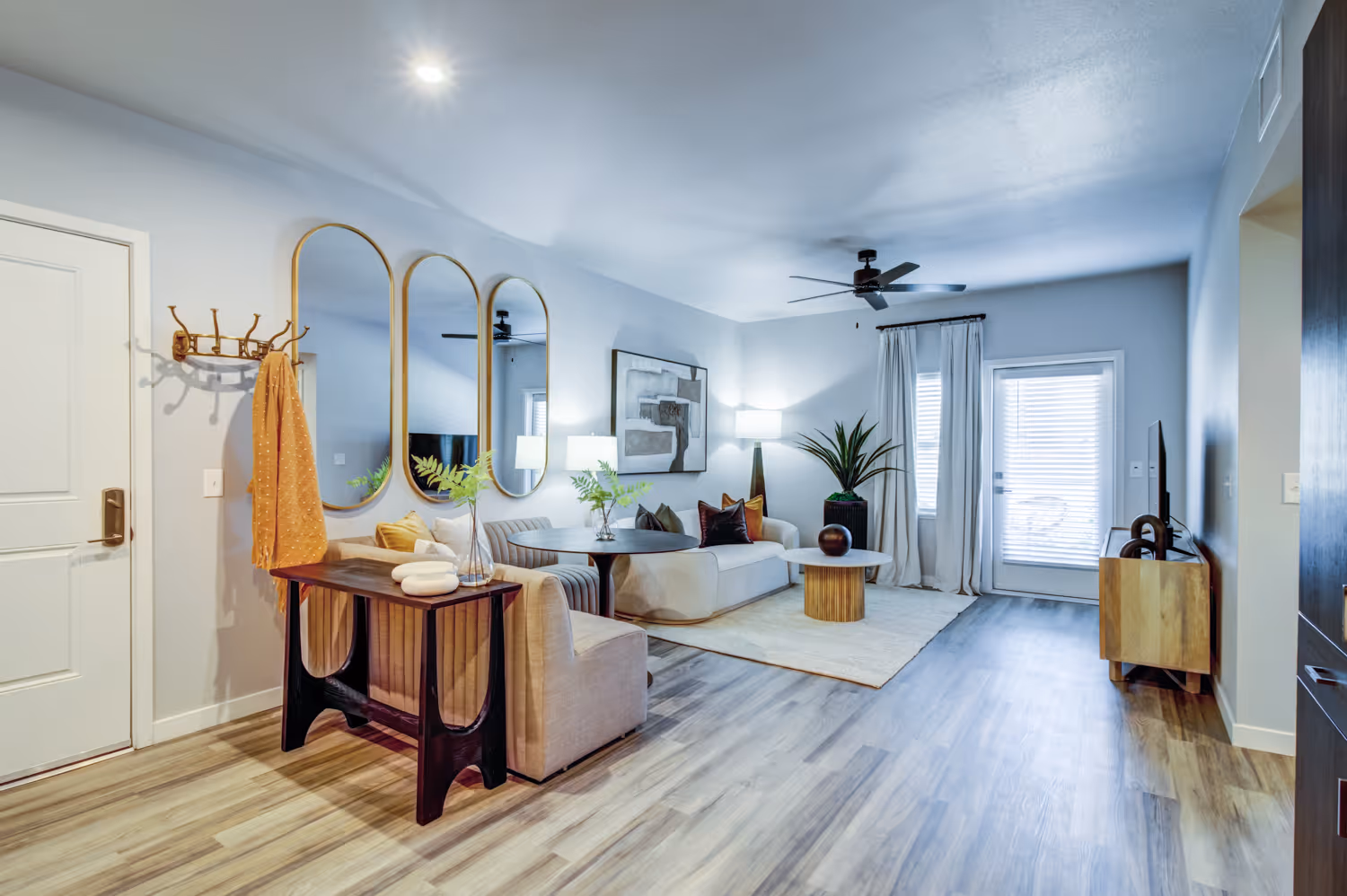 Living room with couch and mirrors