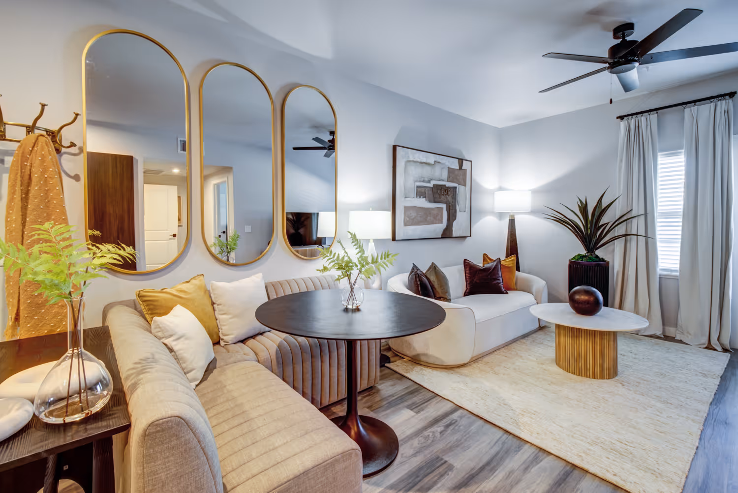 Living room with couch and mirrors