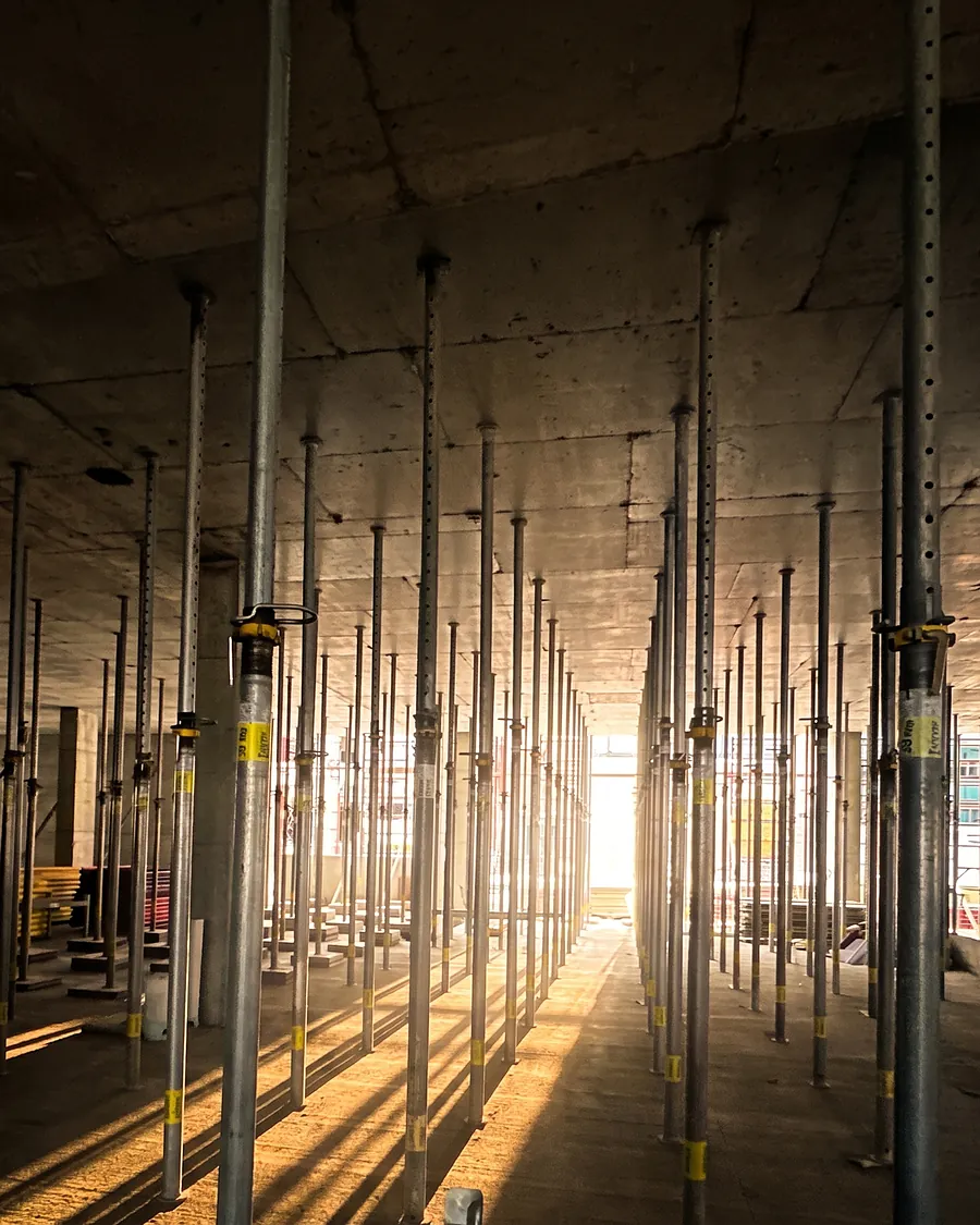 Rows of shoring under a newly poured deck
