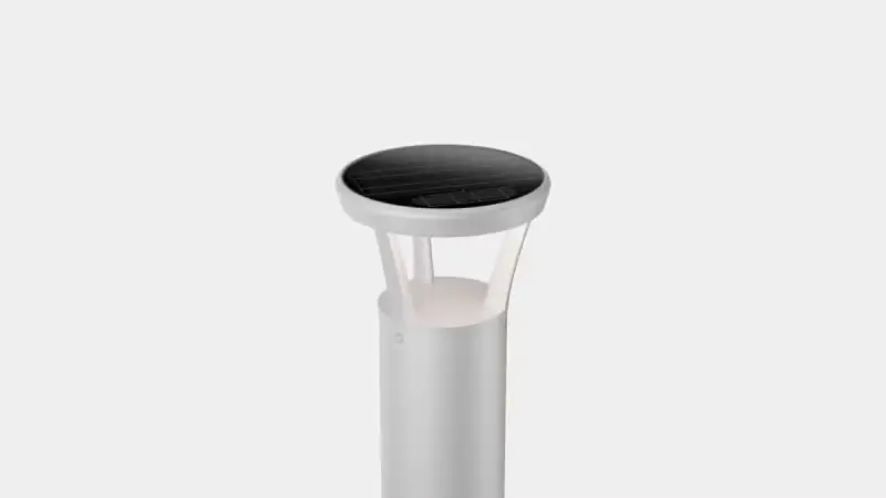 White solar bollard light with a round, flat top and a translucent diffuser panel.