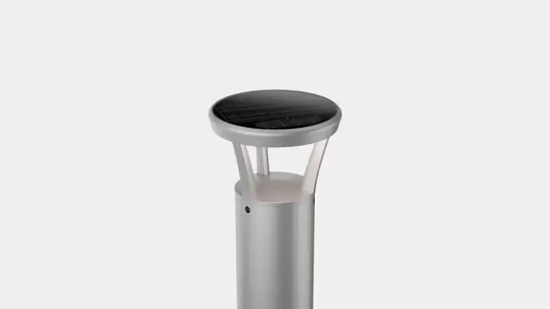 Silver solar bollard light with a round, flat top and a translucent diffuser panel.