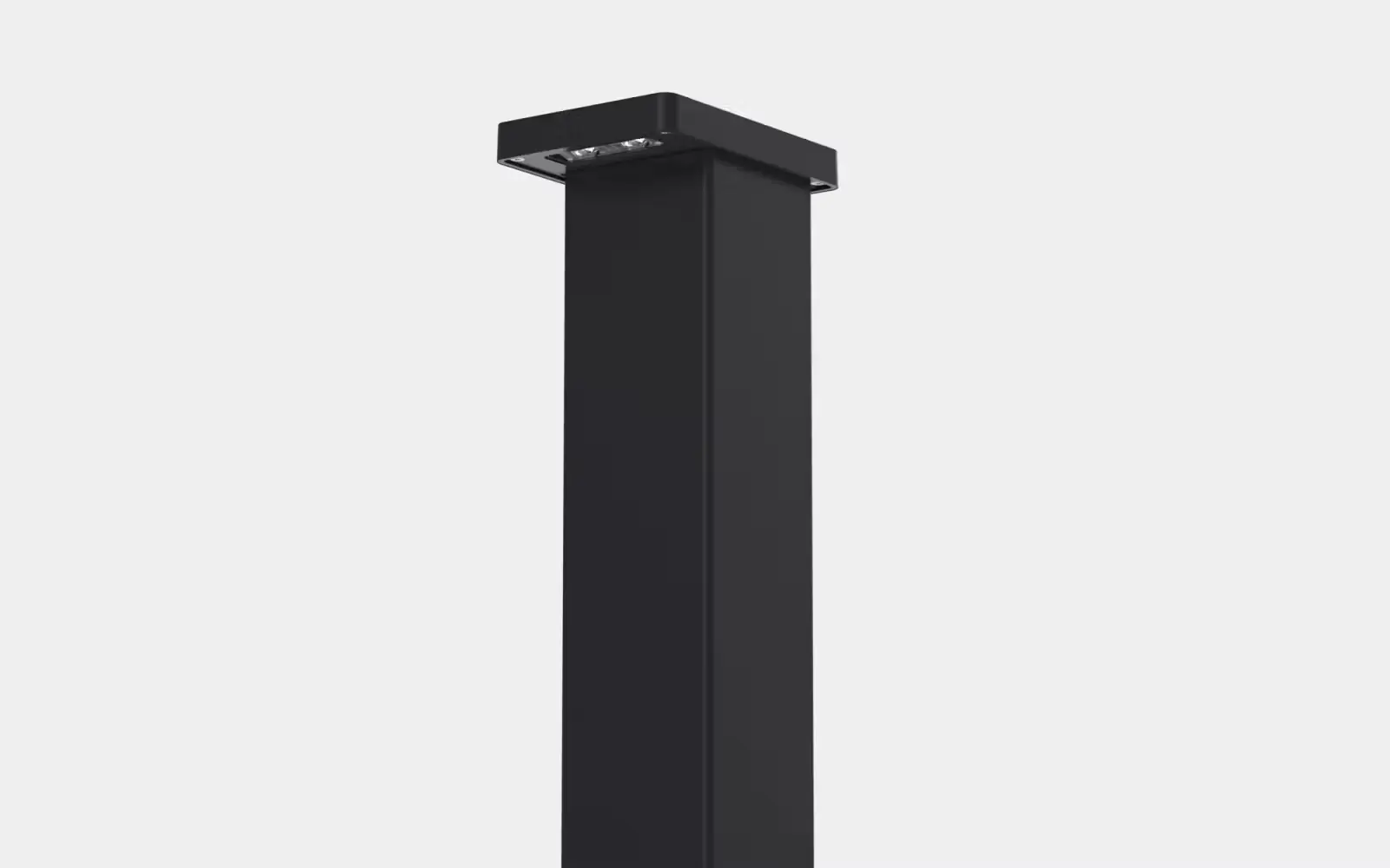 Tall rectangular black outdoor bollard light with multiple LED bulbs on the underside of the top section.