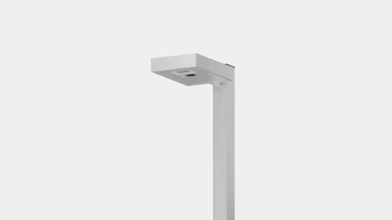 Modern, minimalist gray street lamp post with a rectangular light fixture against a plain light background.