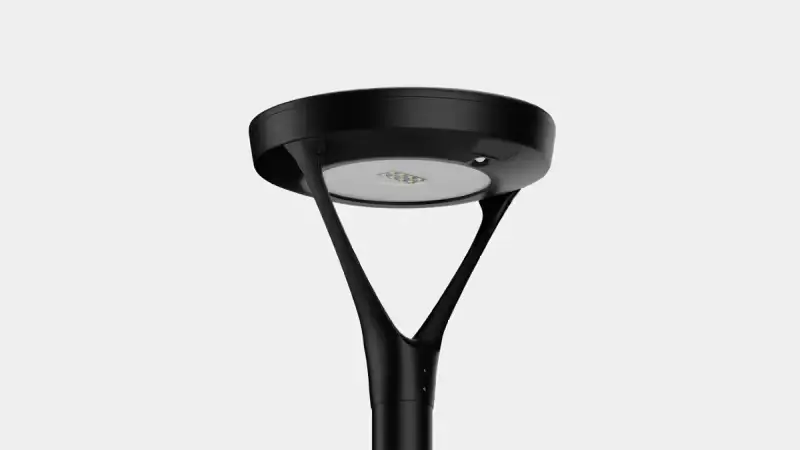 Modern black outdoor LED street lamp against a light gray background.