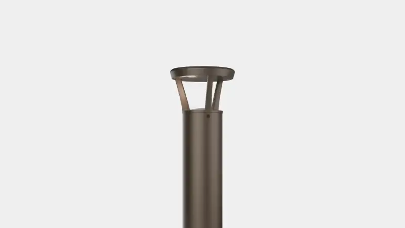 Modern outdoor lamp post with a cylindrical body and a circular shade on top against a plain light background.