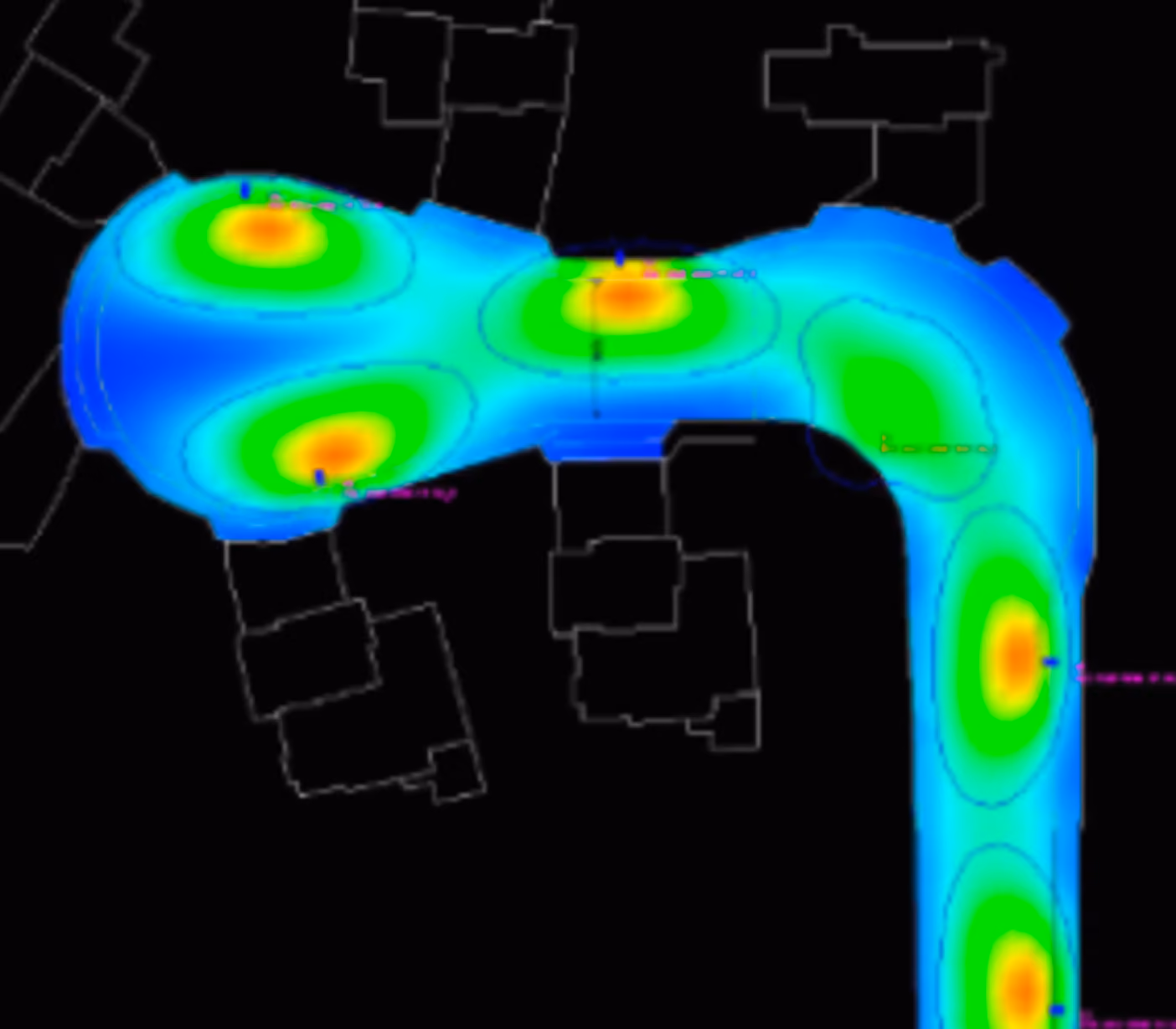 Colorful heatmap with red, green, and blue areas overlaid on a dark background with faint building outlines.