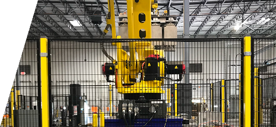Robotic arm on fulfillment center floor.