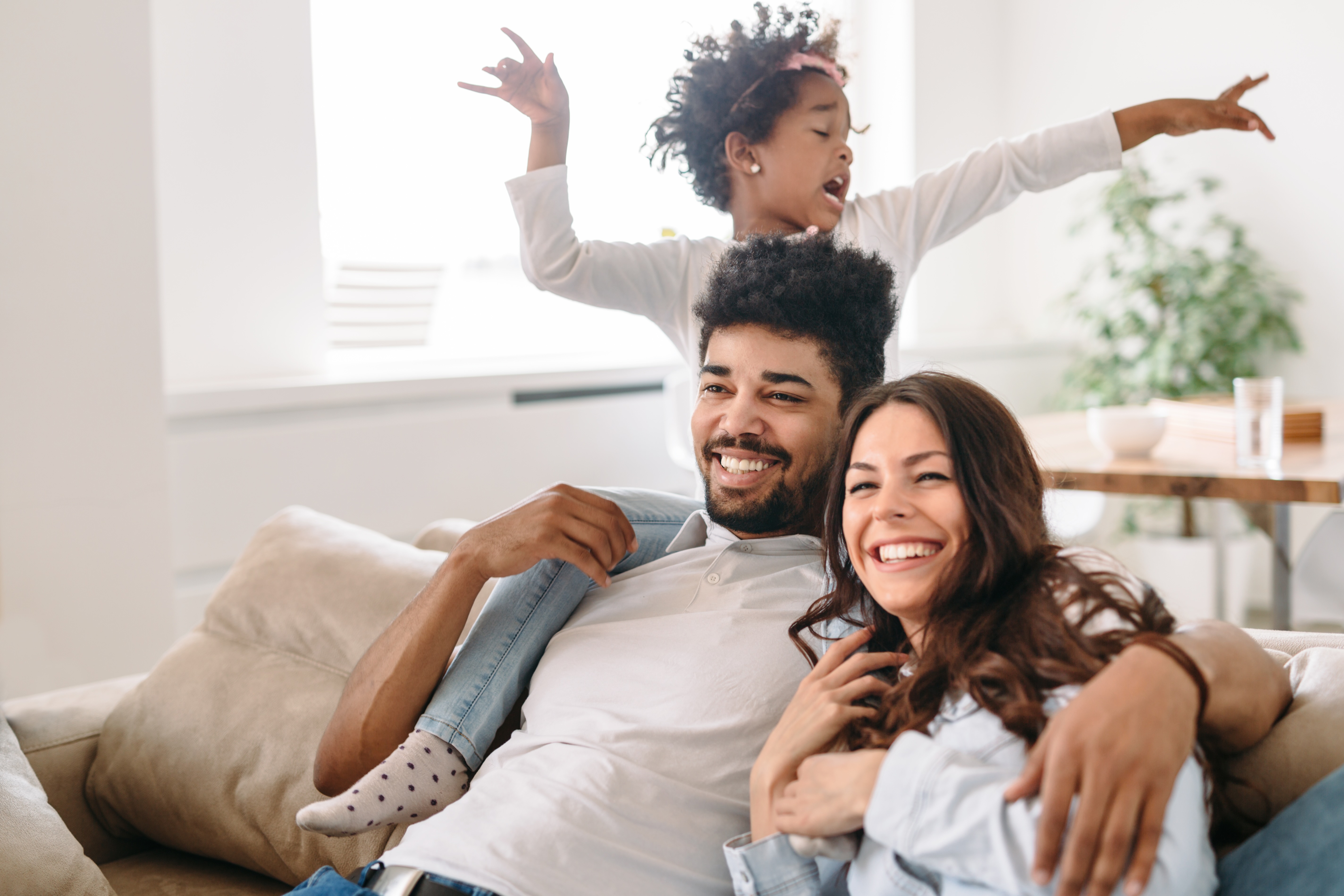 Man, woman, and child sitting together stock image
