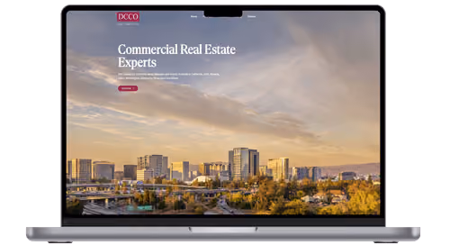 Dan Caputo Co. website and portfolio system displayed on a laptop