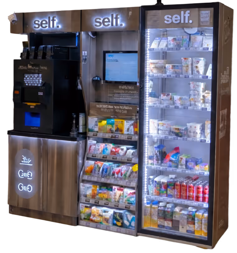 Self-service vending machine with illuminated shelves stocked with packaged snacks and drinks, featuring a central touchscreen interface.