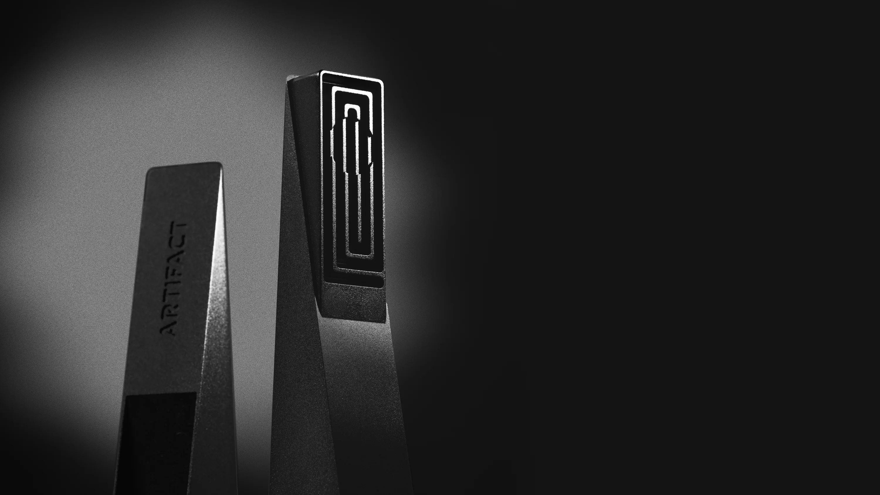 Black Abyss Tempest magnetic cooling pipe standing upright with illuminated square labyrinth interior, photographed against a dark gradient background with dramatic studio lighting