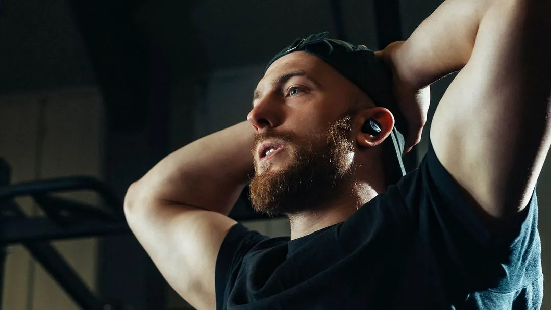 Man holding head in gym