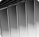 Close-up of black vertical panels with a glossy, reflective surface and diagonal lines.