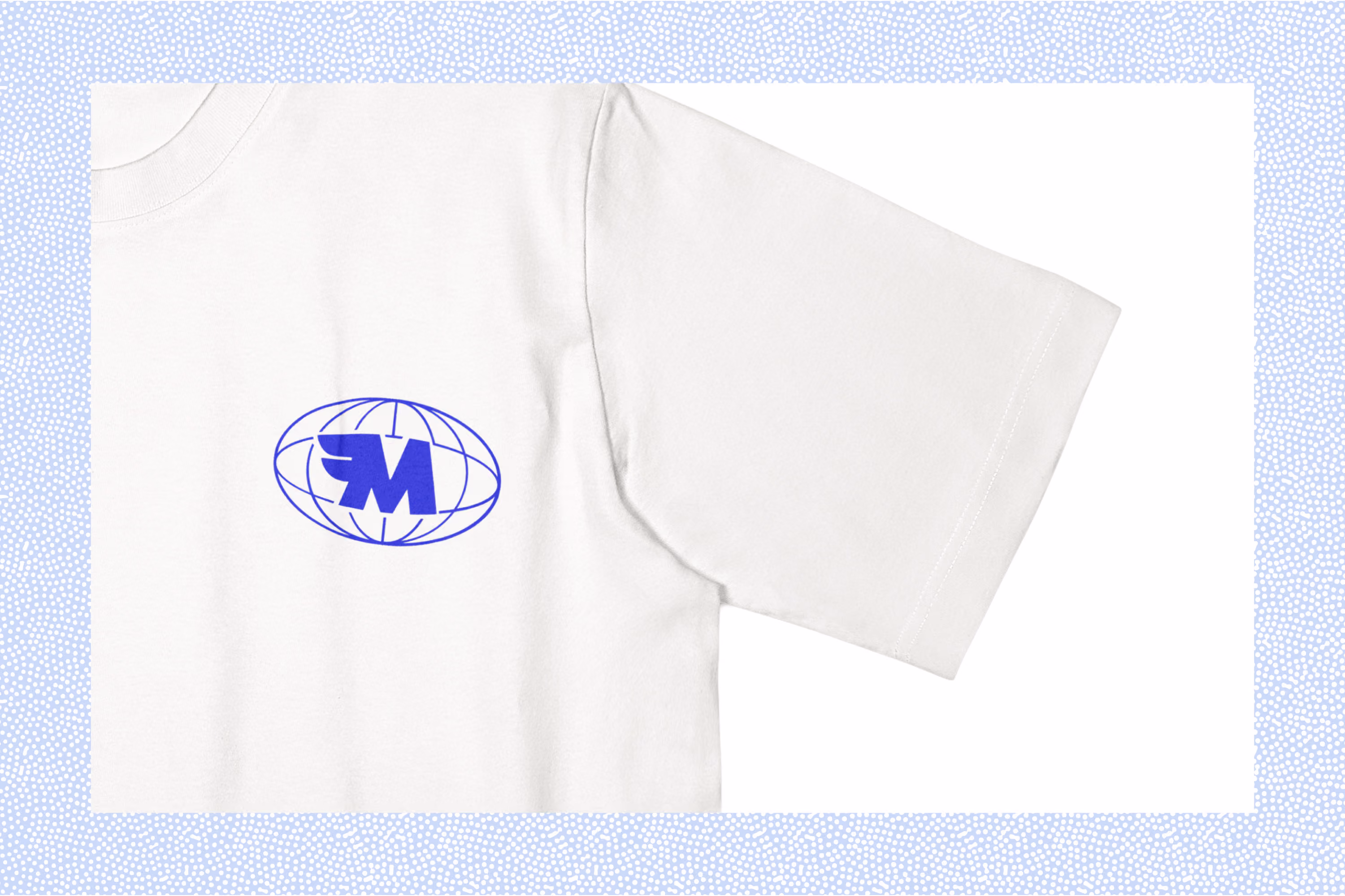 Close-up of a white T-shirt with a blue globe-like emblem and stylized letter M on the front left side.