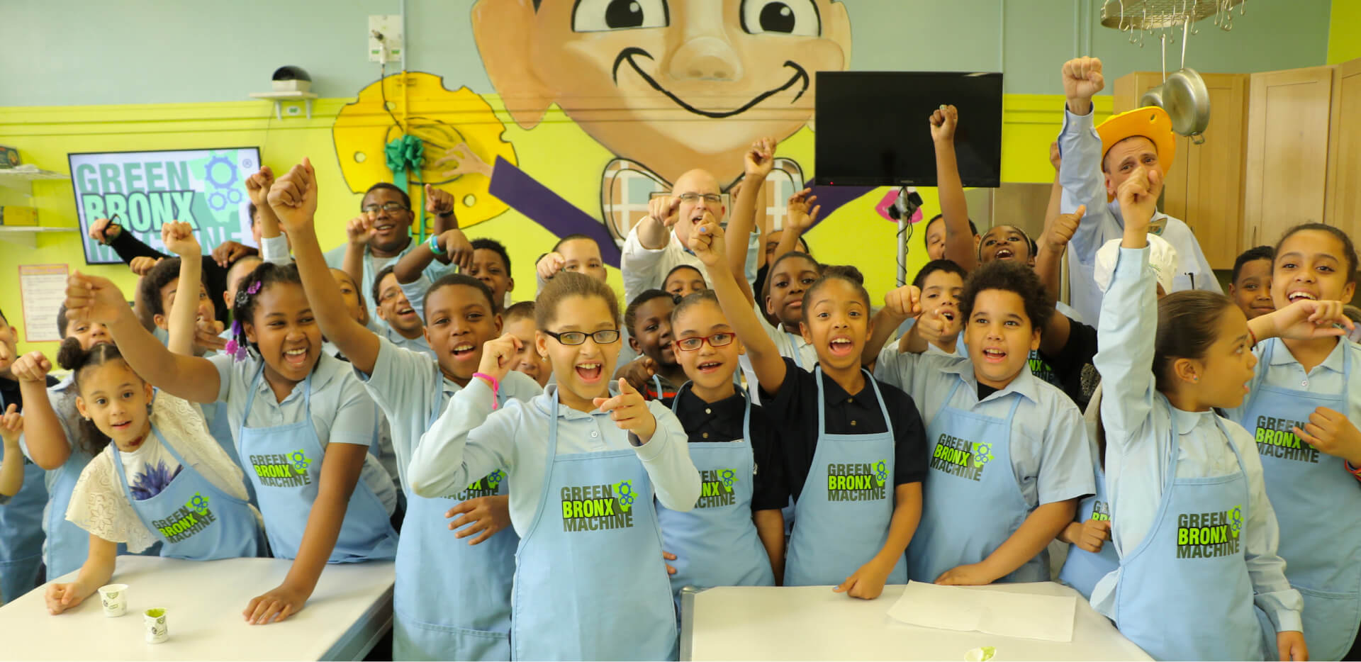 Students and teachers celebrating in a Green Bronx Machine classroom