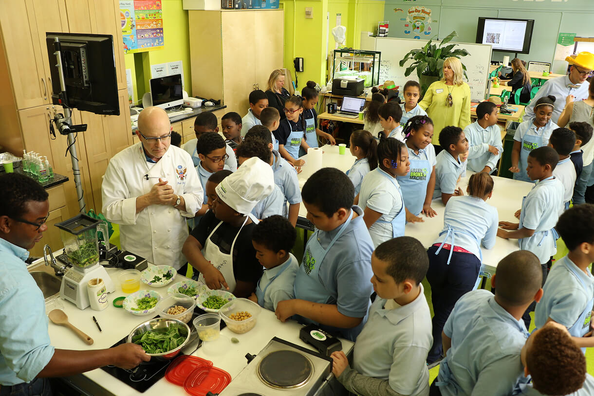 Students preparing food together in the classroom