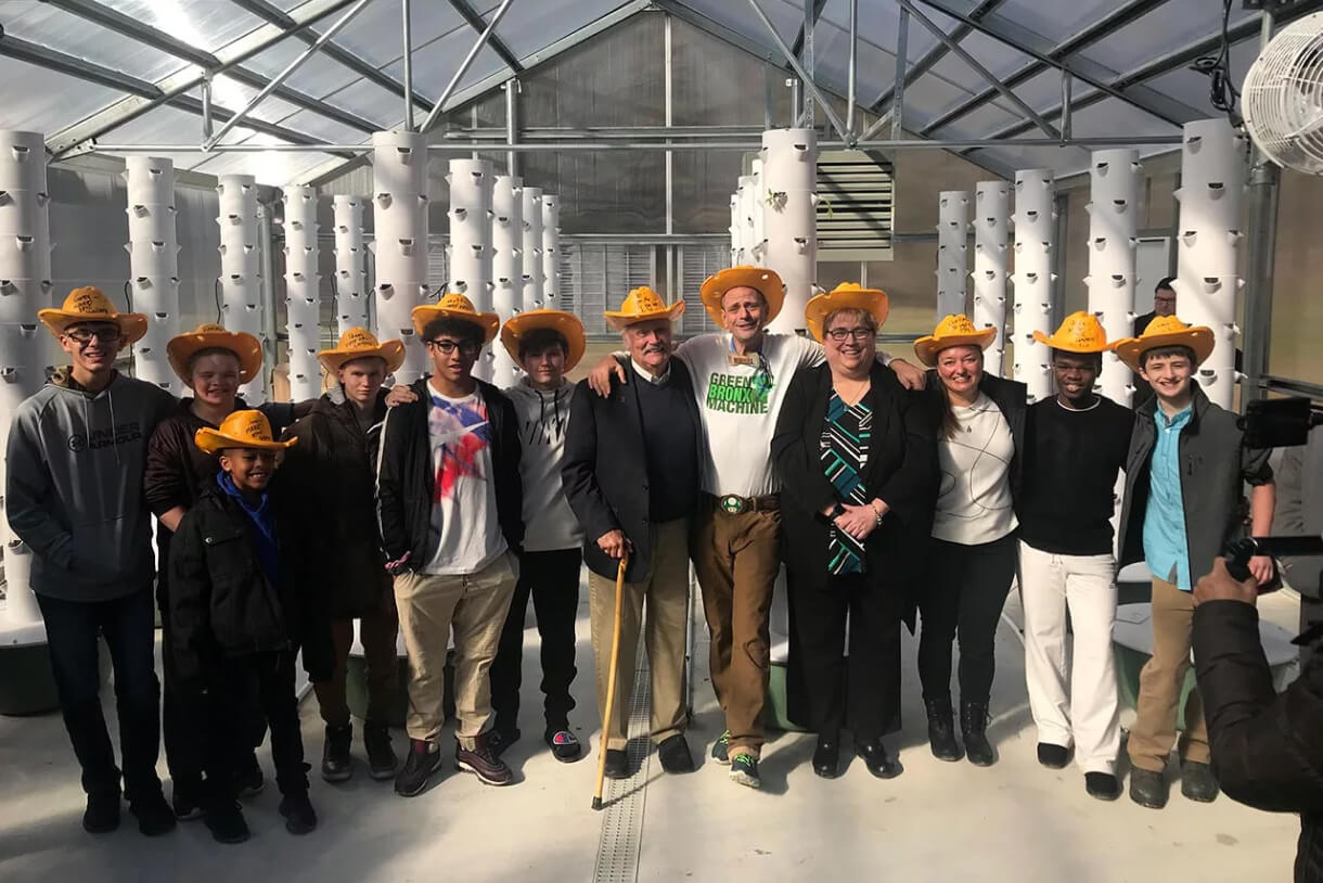 Students and educators with classroom tower gardens
