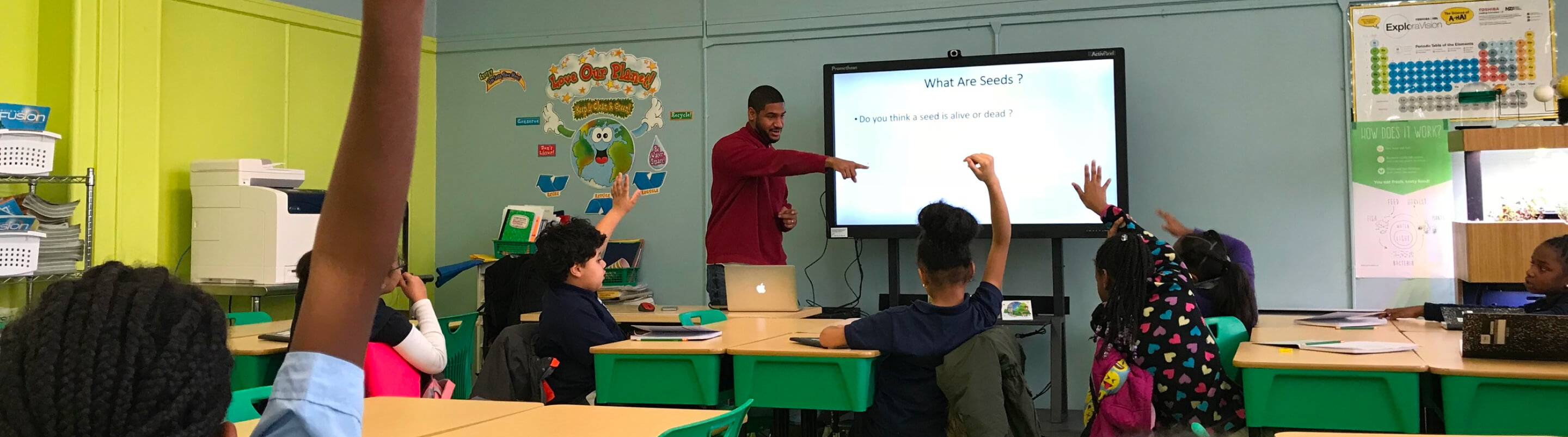 Teacher leading a lesson on seeds in a Green Bronx Machine classroom