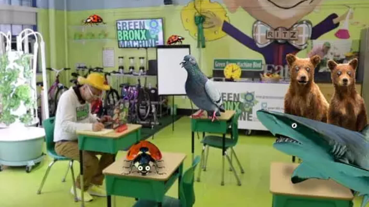 Mister Ritz teaching in a classroom with Tower Gardens and puppet characters