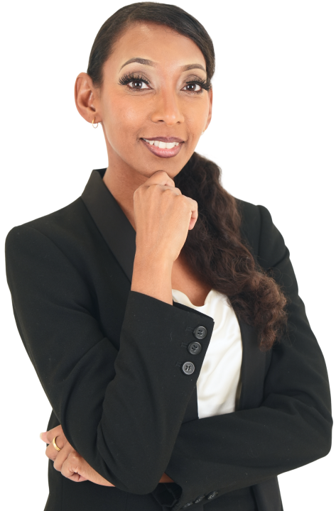 Confident woman with long curly hair wearing a black blazer and white blouse, smiling with hand near her chin.