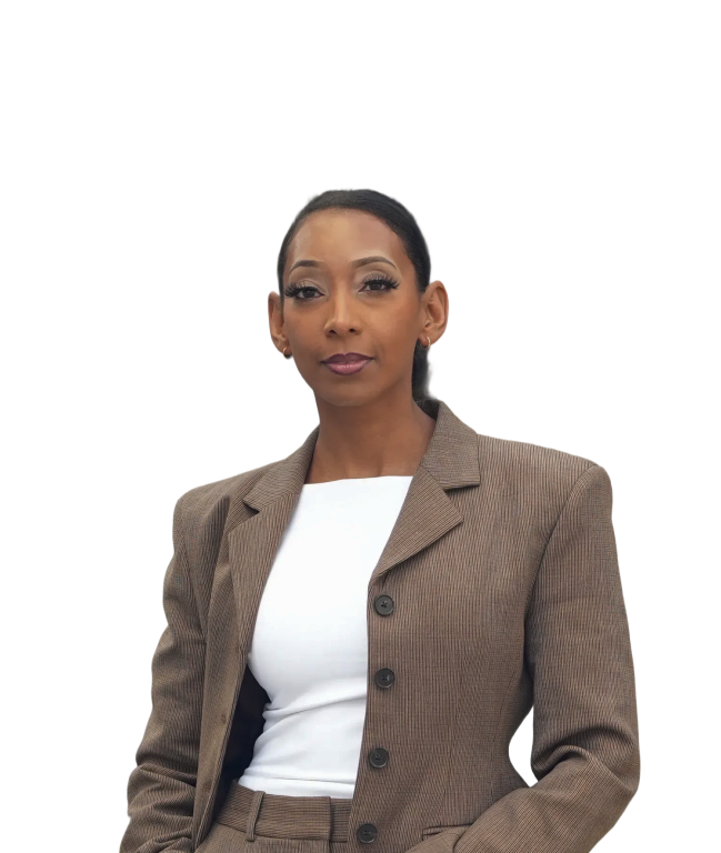 Confident woman wearing a brown pinstripe blazer over a white top, looking directly at the camera.