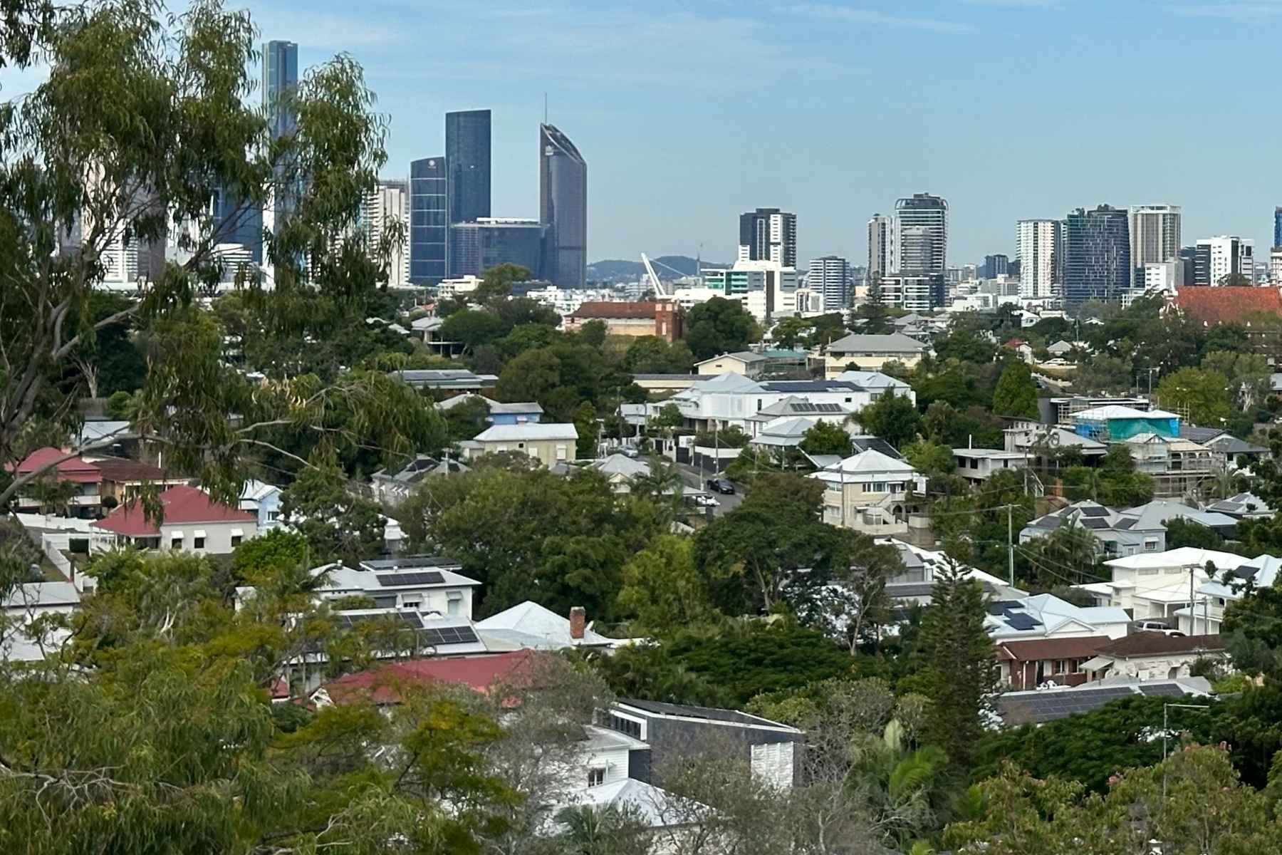 Inner Brisbane homes and city skyline representing SEQHomes property management for higher-value rentals