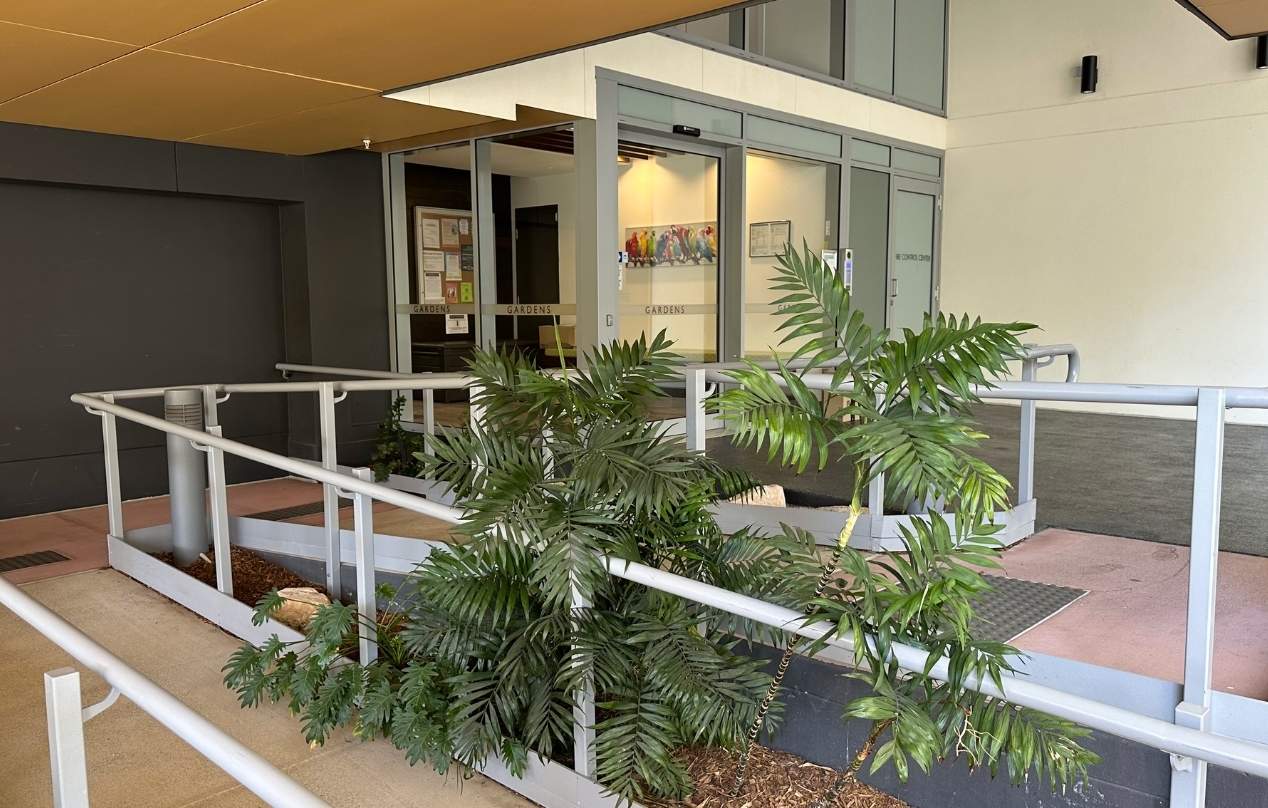 Apartment building entry and access ramp representing routine rental property inspections