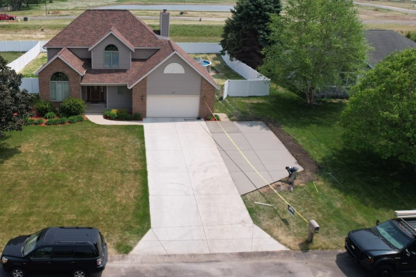 Concrete driveway expansion installation in Grand Rapids Michigan