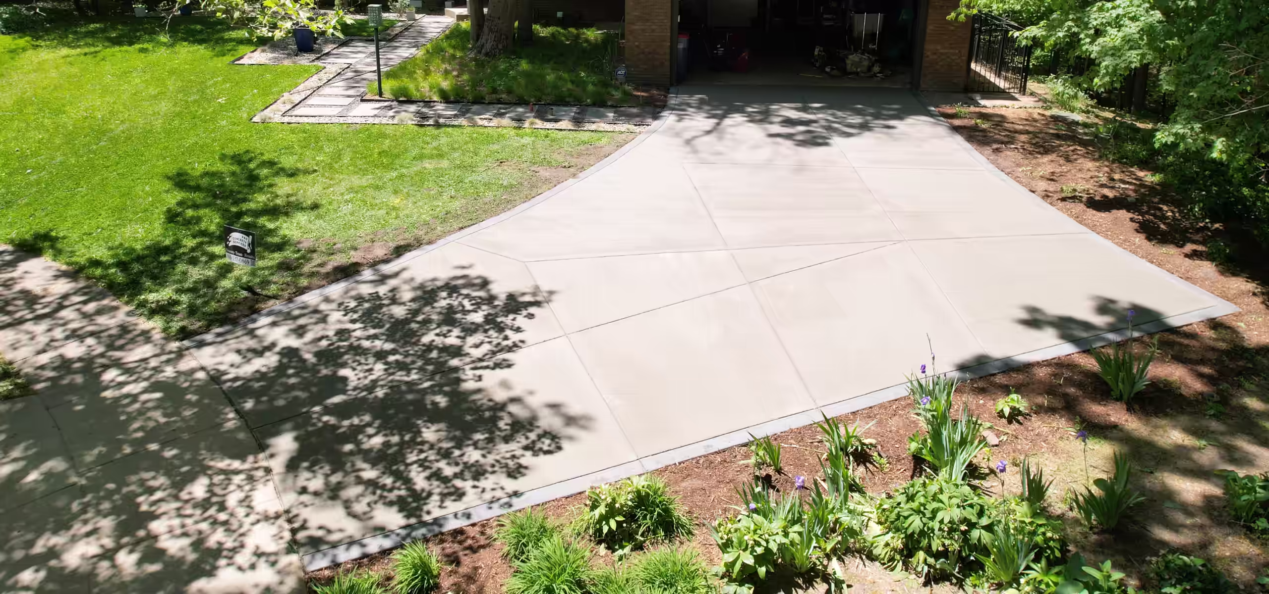 Broom finish concrete driveway poured by Pro Concrete Services in Grand Rapids, MI