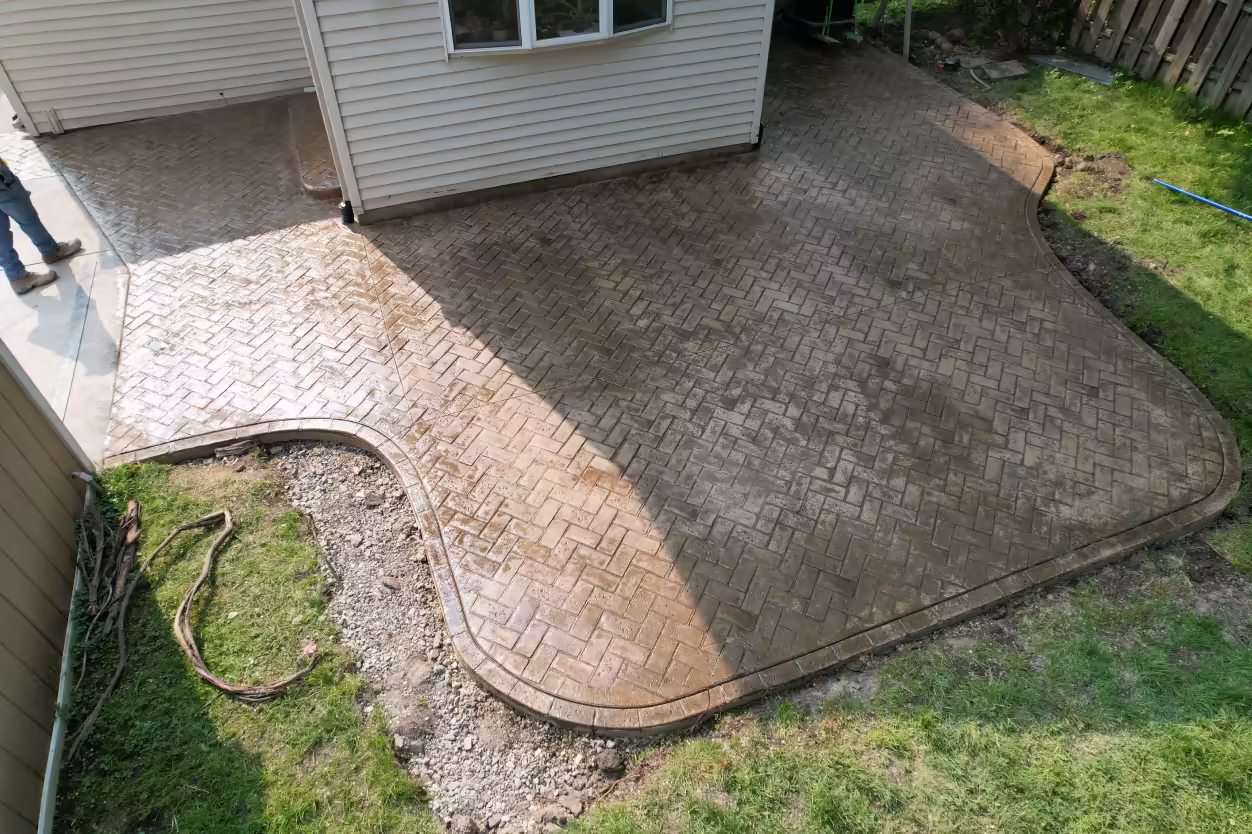 Herringbone stamped concrete patio with sealer application, Grand Rapids MI
