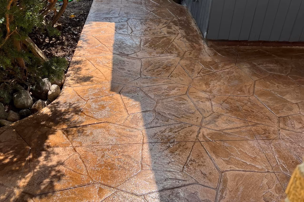 Detail shot of sealed stamped flagstone concrete surface showing texture and color variation in Grand Rapids MI