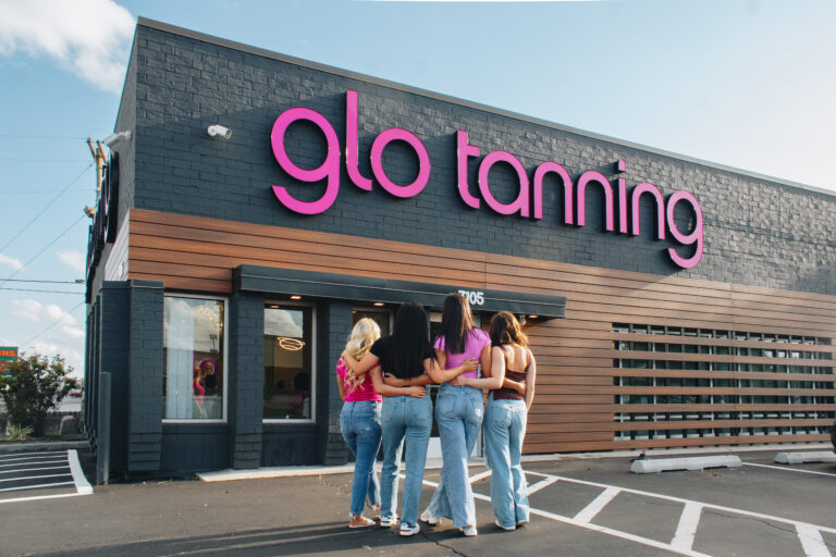 A high-tech manufacturing facility with a person walking through, representing the precision and reliability of Nimbus Library.