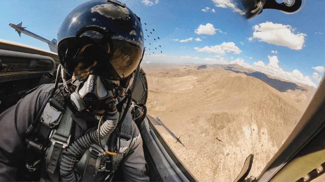 F5 pilot flying, inside cockpit over desert