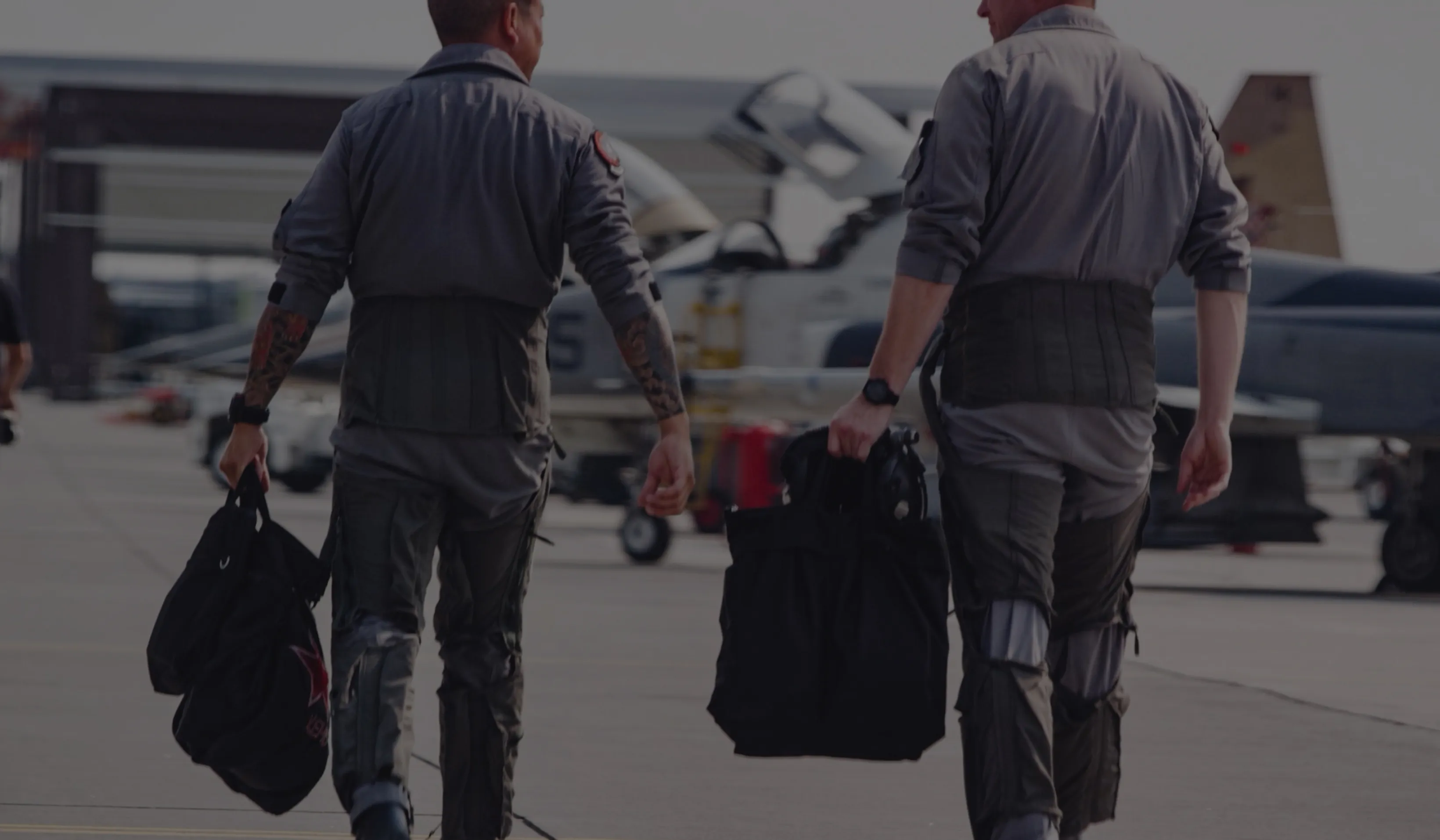 a group of men walking with luggage