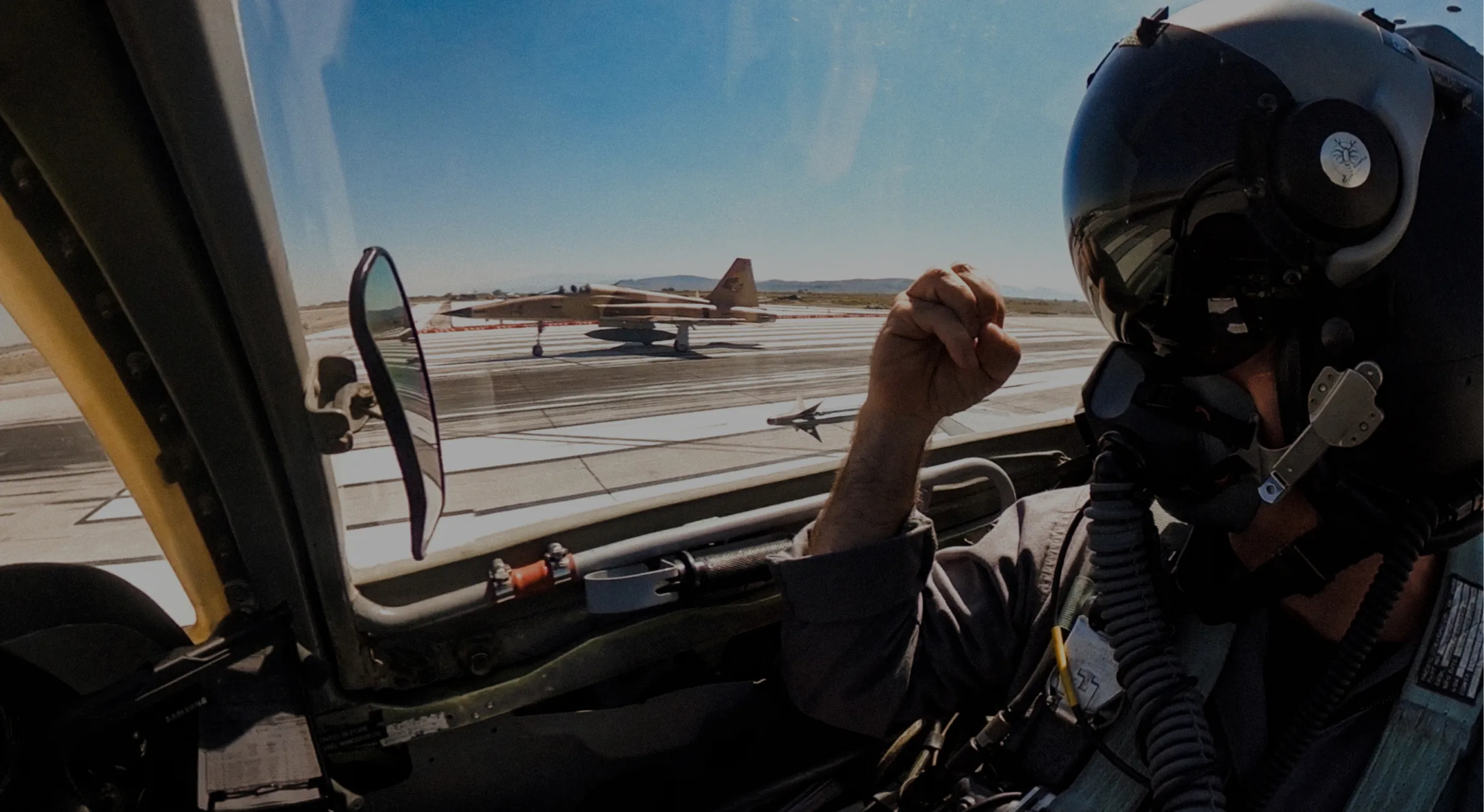 a pilot in a jet cockpit