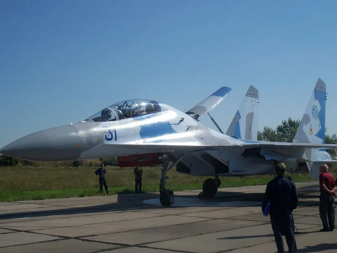 SU-35 aircraft on runway preparing to takeoff