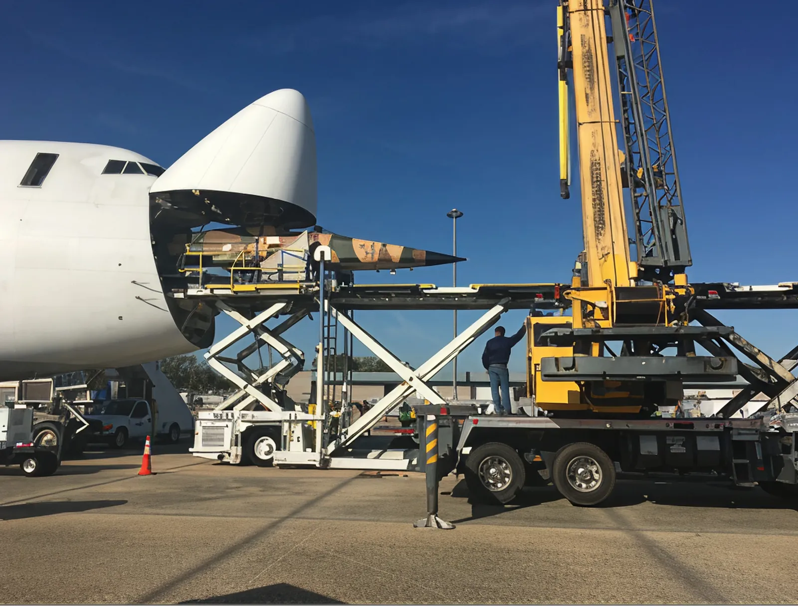 F5 loading onto transport aircraft with crane in front