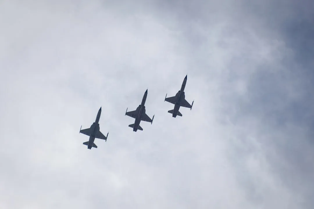 Formation of three aircraft flying overhead