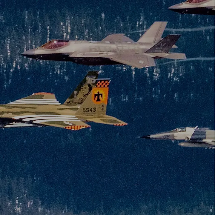 F-35 Lightning II flying next to F-16 Fighting Falcon in formation
