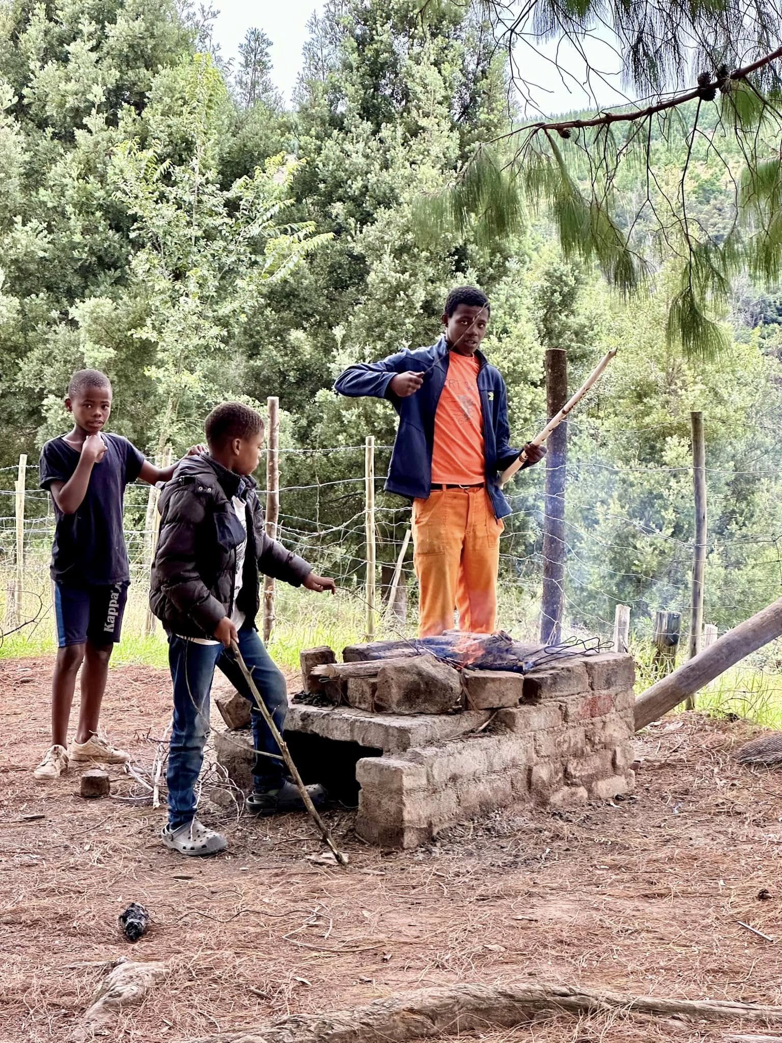 Walking stick makers at the entrance to the Madonna and Child waterfall hike