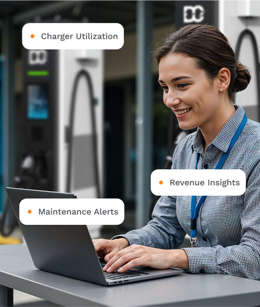 Woman sitting at a table working on a laptop with electric vehicle chargers in the background, highlighting charger utilization, maintenance alerts, and revenue insights.